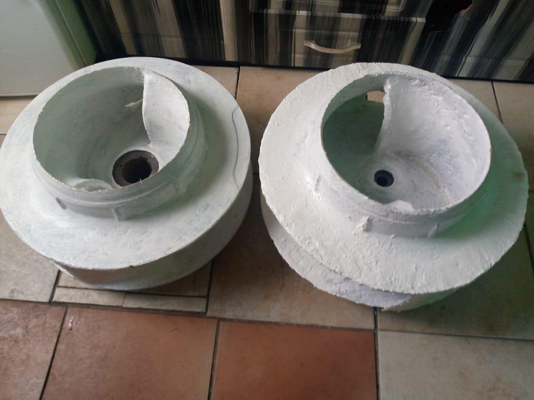 Two pump impellers rebuilt and finished with ceramic-filled wear-resistant coating